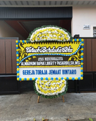 Papan Bunga Duka di Napan