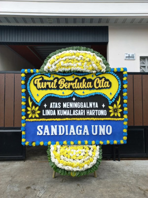 Papan Bunga Duka di Napan